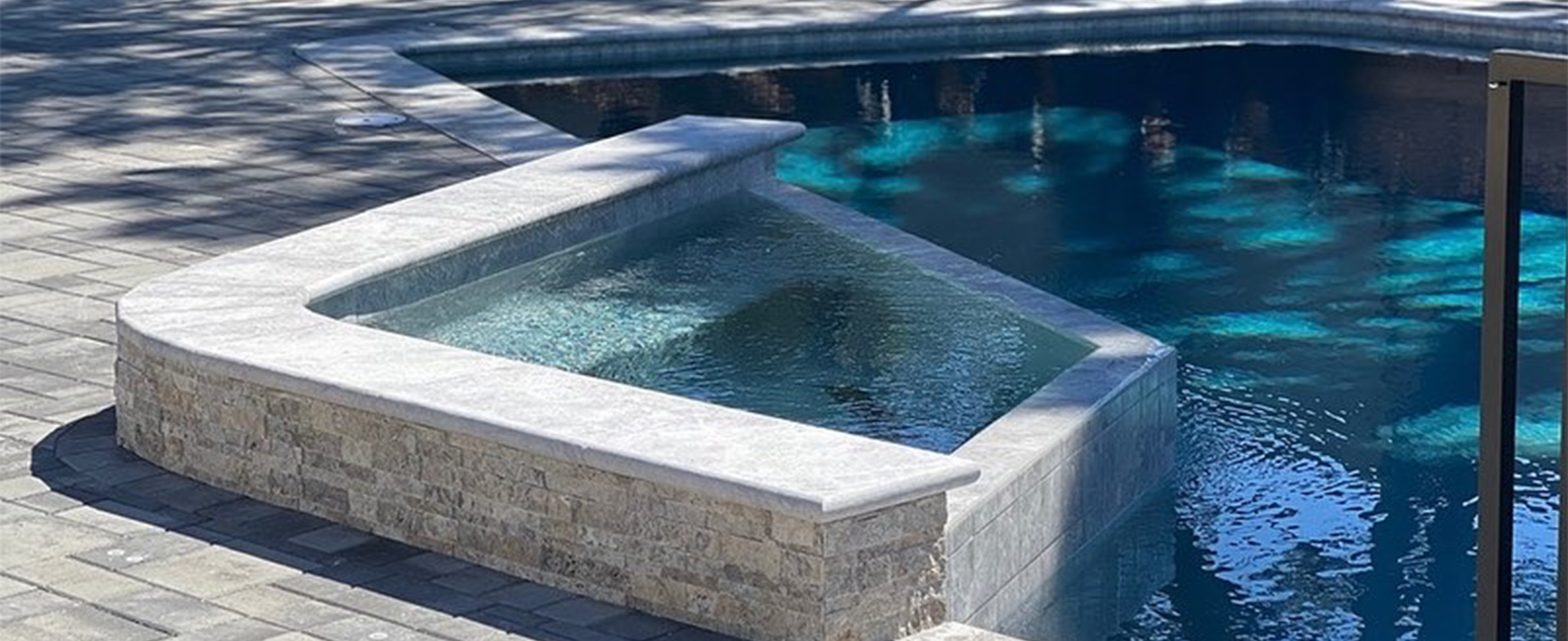 Modern jacuzzi and swimming pool tiles terrace.